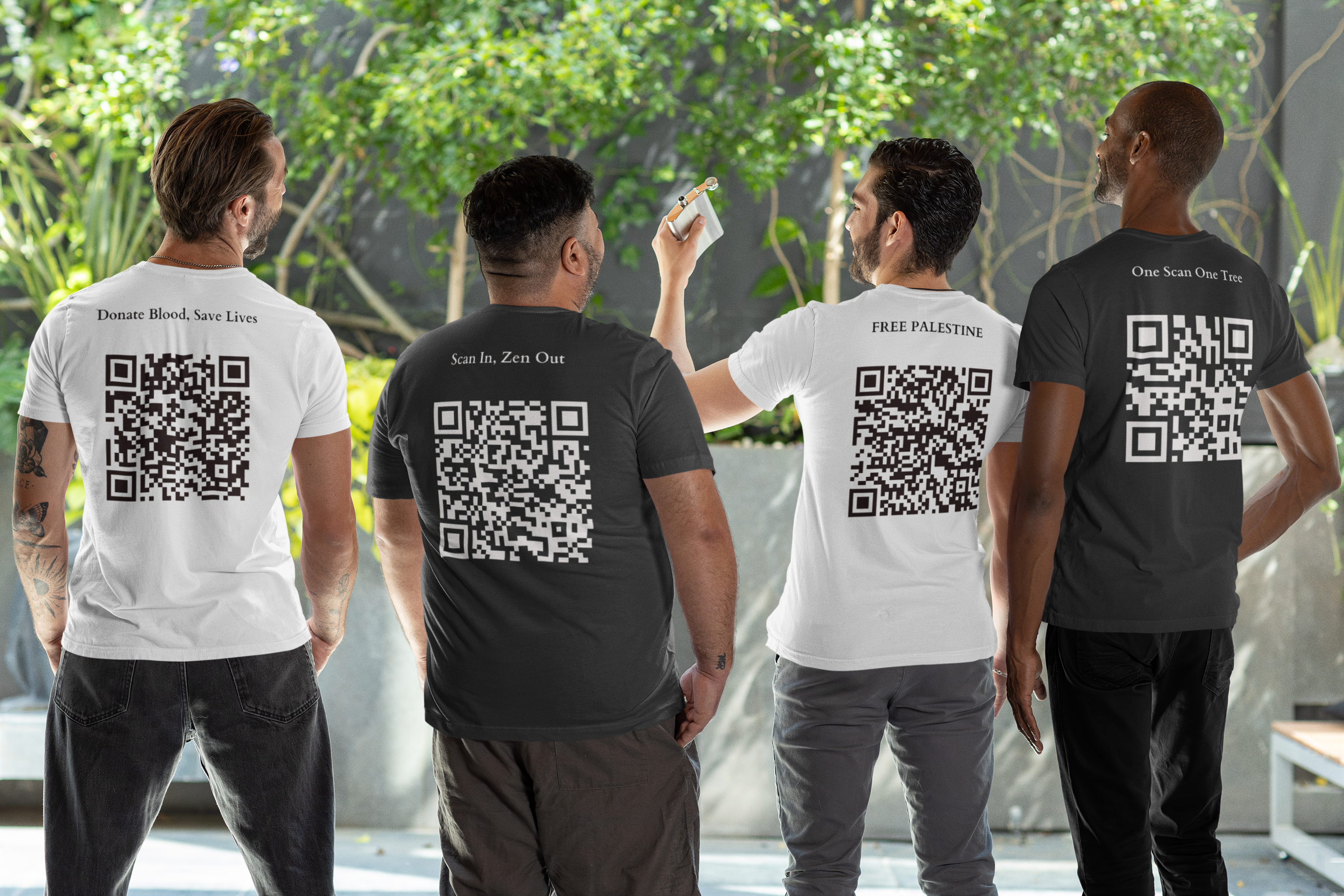 Four men standing, each wearing a t-shirt with a unique QR code and message on the back: "Donate Blood, Save Lives," "Scan In, Zen Out," "FREE PALESTINE," and "One Scan One Tree."